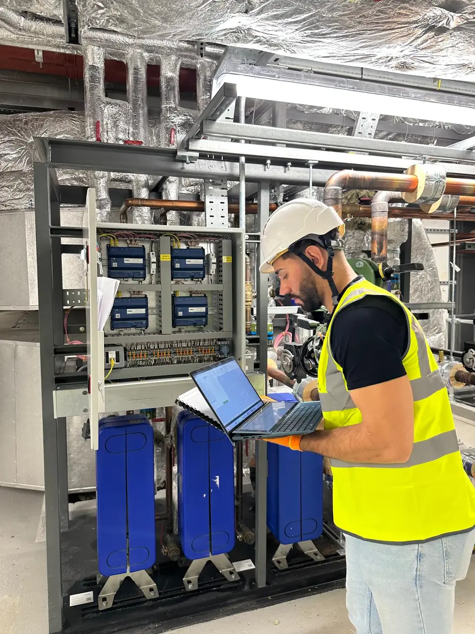 OD Controls engineer commissioning a BMS cabinet on site in central London