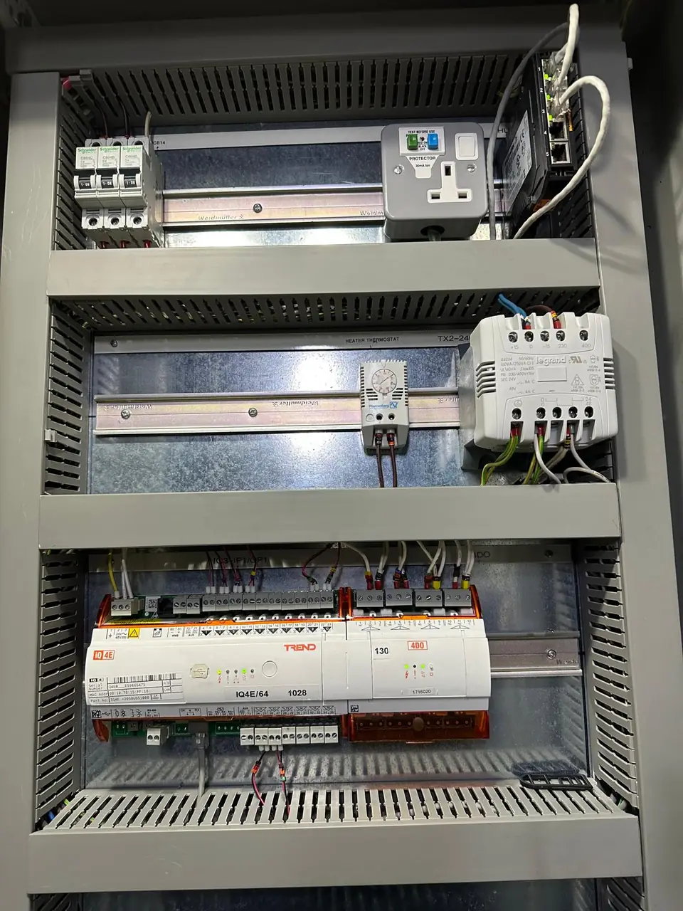 OD Controls engineer carrying out fault-finding on a column-mounted BMS control panel