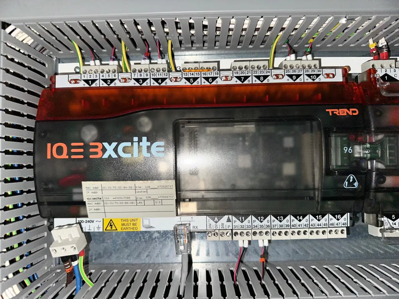 Engineer commissioning a Liebert PDX data centre cooling unit with Danfoss VFD